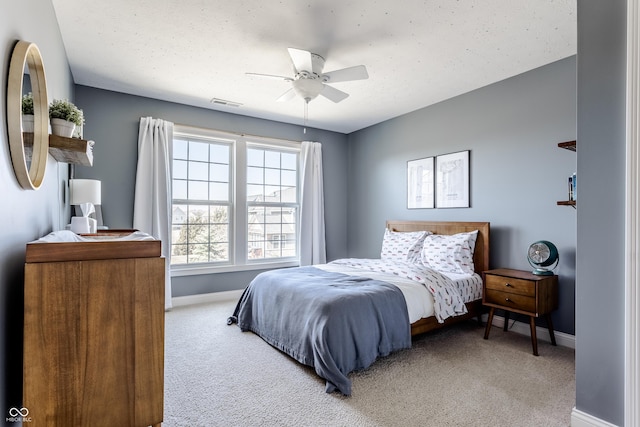 bedroom featuring carpet flooring, baseboards, and visible vents