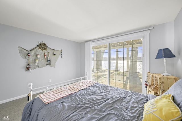 carpeted bedroom featuring baseboards