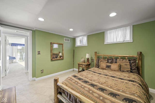 bedroom featuring visible vents, baseboards, light colored carpet, and crown molding