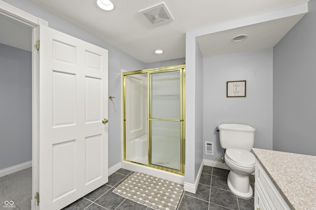 bathroom with visible vents, toilet, a stall shower, baseboards, and vanity