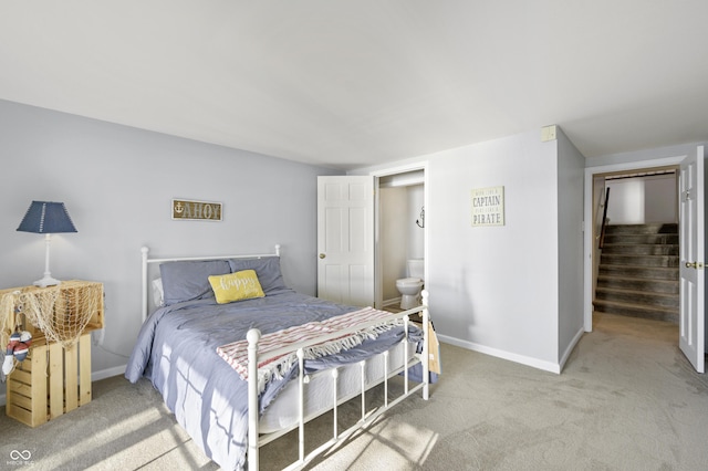 carpeted bedroom featuring baseboards