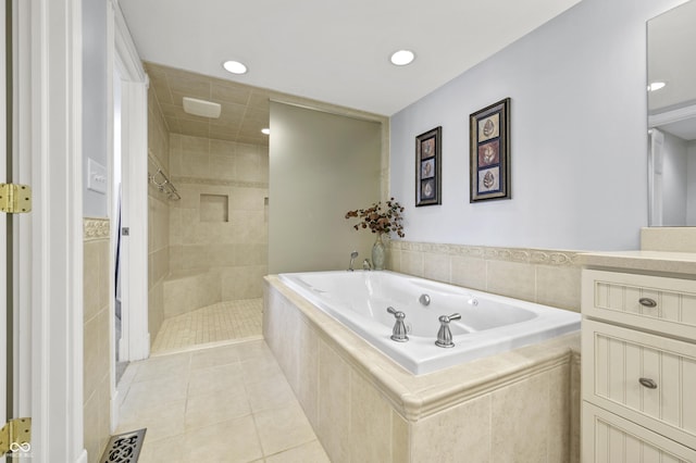 bathroom featuring visible vents, tile patterned floors, tiled shower, a bath, and vanity