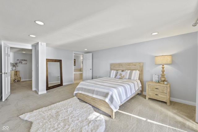 carpeted bedroom with recessed lighting, connected bathroom, and baseboards