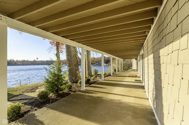 view of patio with a water view