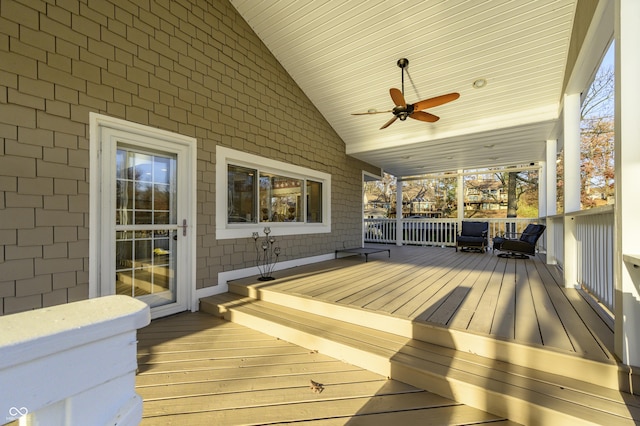 wooden deck featuring ceiling fan