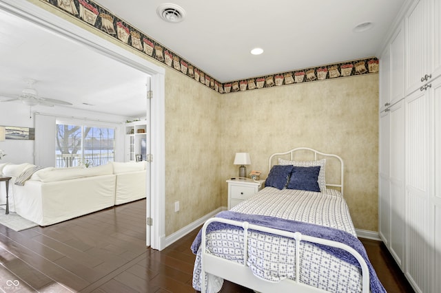 bedroom featuring recessed lighting, visible vents, baseboards, and dark wood-style flooring