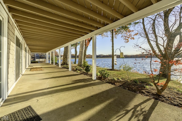 view of patio featuring a water view