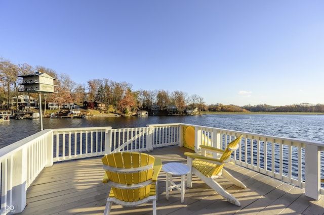 wooden deck with a water view