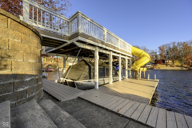 view of dock featuring boat lift and a water view