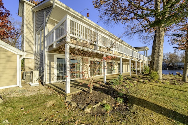 back of house featuring a patio area and cooling unit