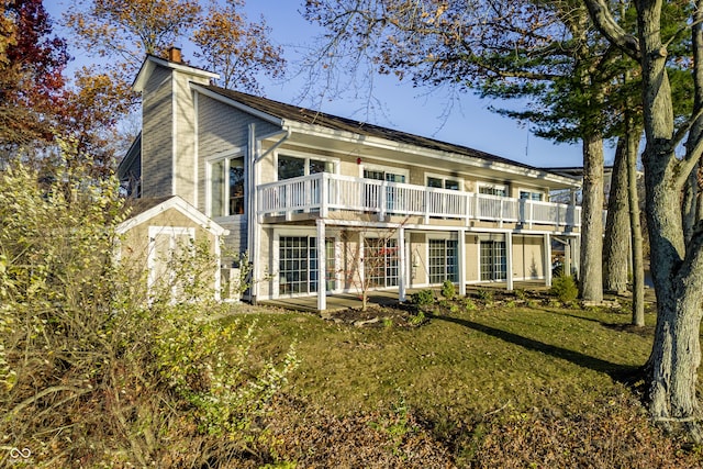 exterior space featuring a yard and a chimney