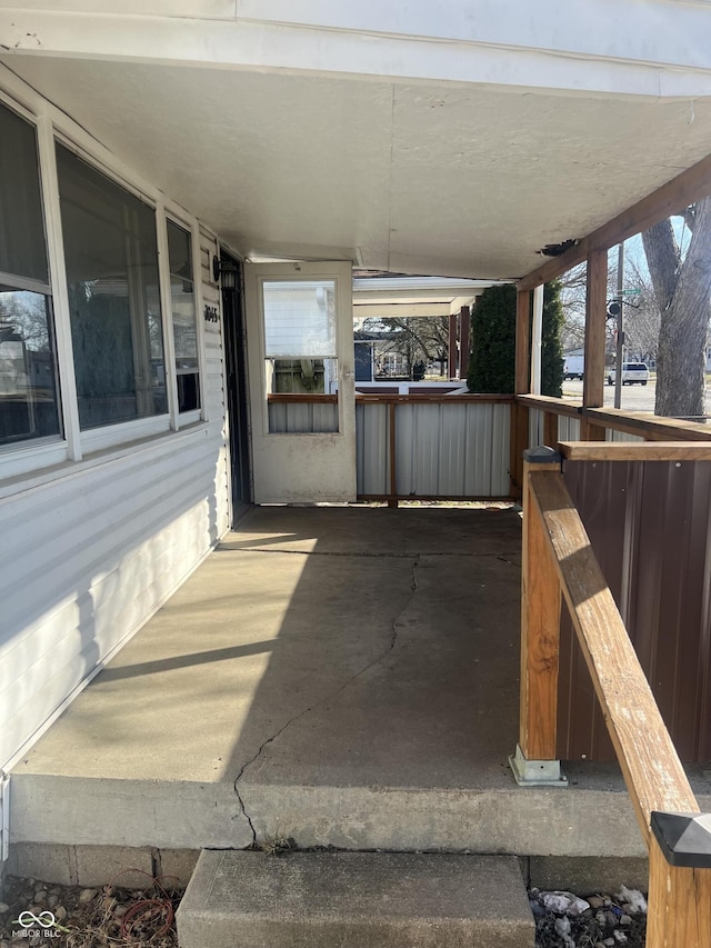 view of patio / terrace with an attached carport