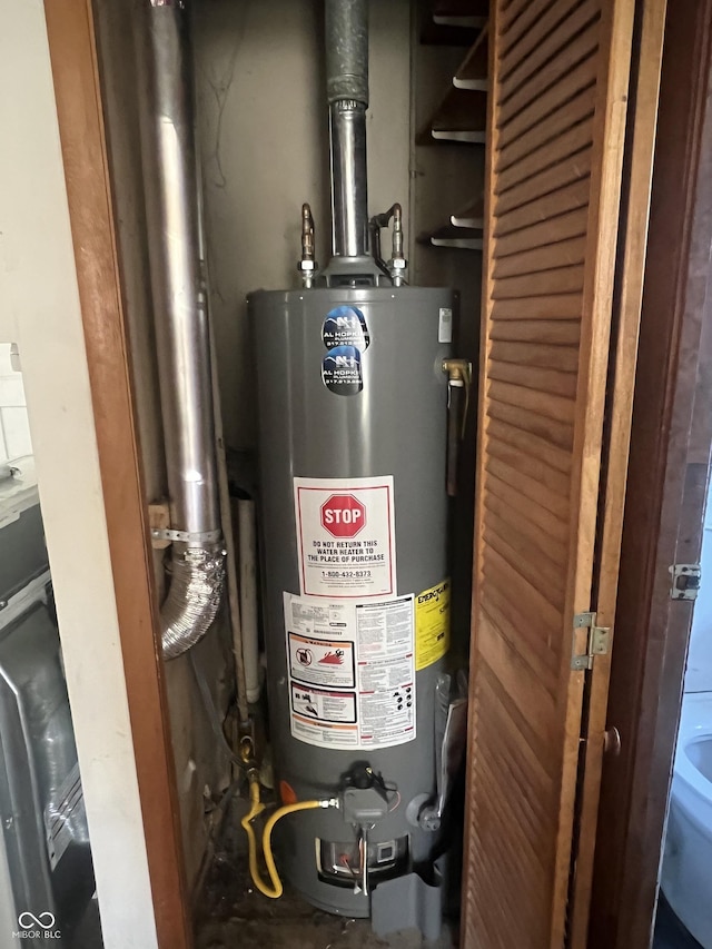 utility room with gas water heater