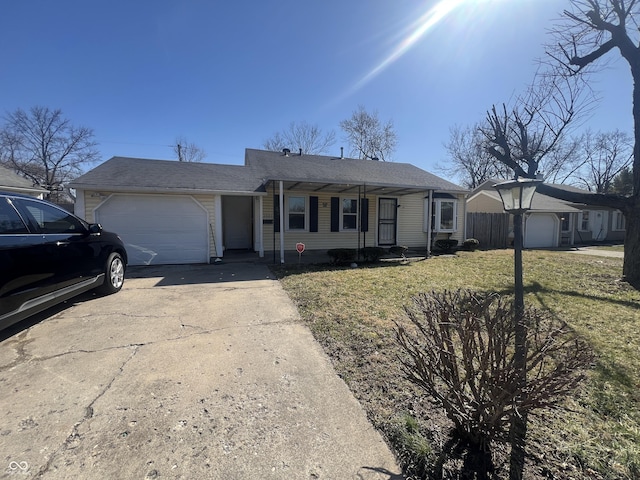 ranch-style home with driveway, a front yard, and a garage