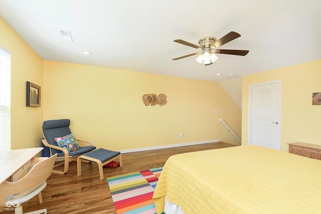 bedroom with a ceiling fan, wood finished floors, baseboards, recessed lighting, and vaulted ceiling