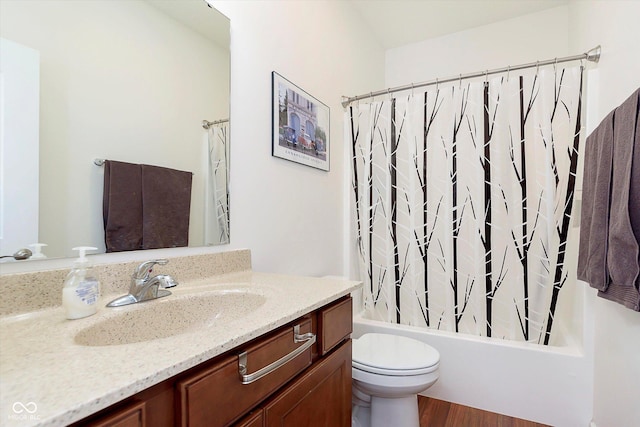 bathroom featuring shower / bathtub combination with curtain, toilet, wood finished floors, and vanity