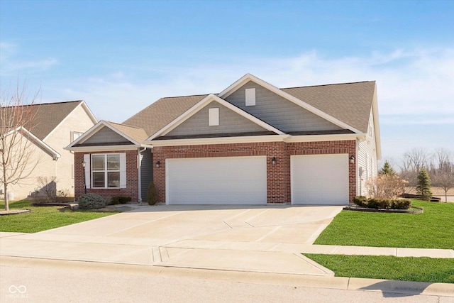 view of front facade featuring a garage, driveway, brick siding, and a front yard