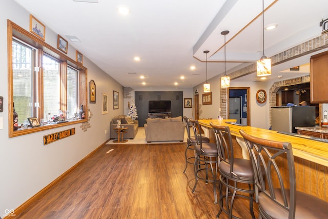 kitchen with baseboards, dark wood finished floors, decorative light fixtures, recessed lighting, and freestanding refrigerator