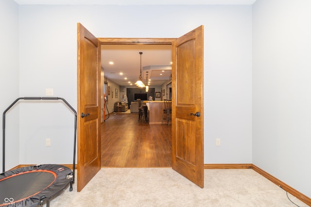 hall with recessed lighting, baseboards, and carpet floors