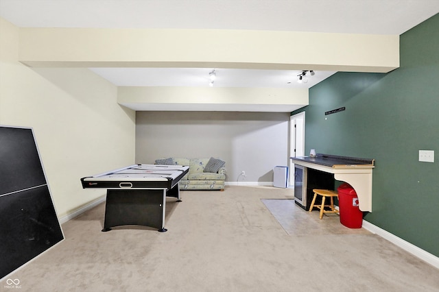 rec room with baseboards and carpet floors