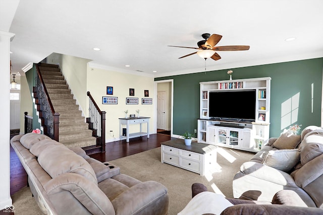 living room with ceiling fan, recessed lighting, ornamental molding, and stairs