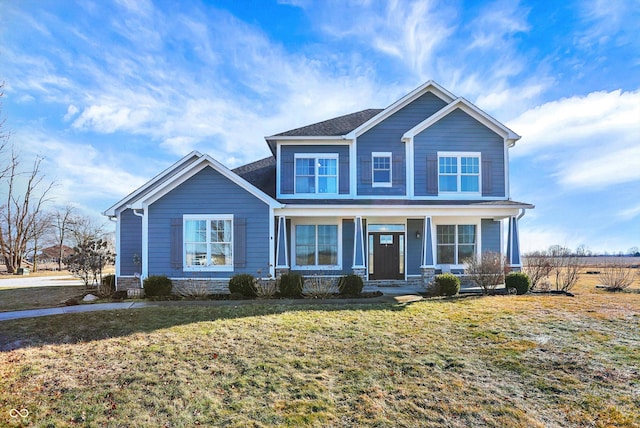 view of front of property with a front lawn and stone siding