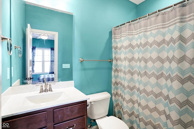 full bathroom featuring toilet, vanity, a shower with shower curtain, and connected bathroom