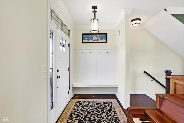 entryway with baseboards, wood finished floors, and ornamental molding