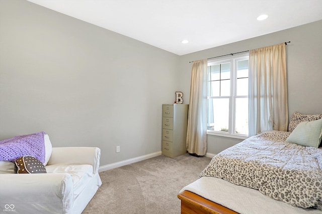 bedroom with recessed lighting, light colored carpet, and baseboards