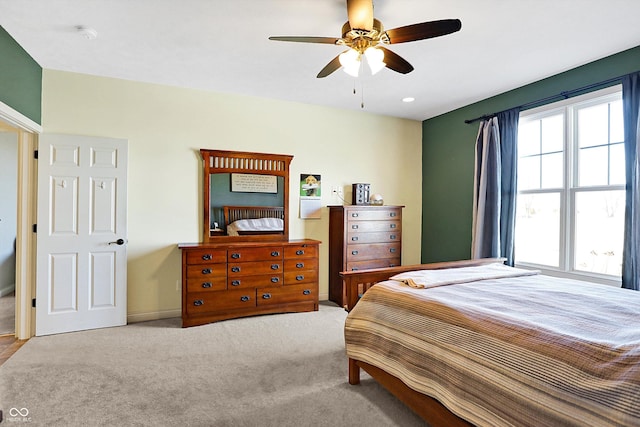 carpeted bedroom with ceiling fan