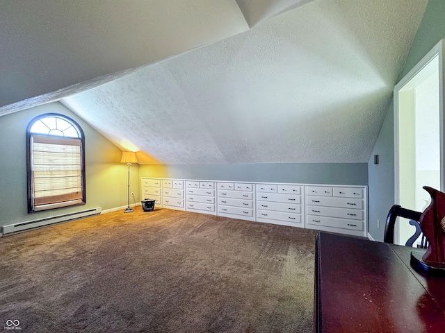 additional living space featuring a baseboard heating unit, vaulted ceiling, carpet, and a textured ceiling