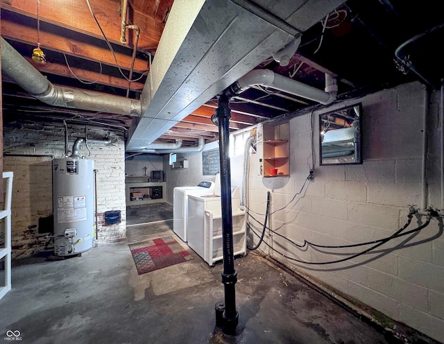 basement featuring gas water heater and washer and dryer