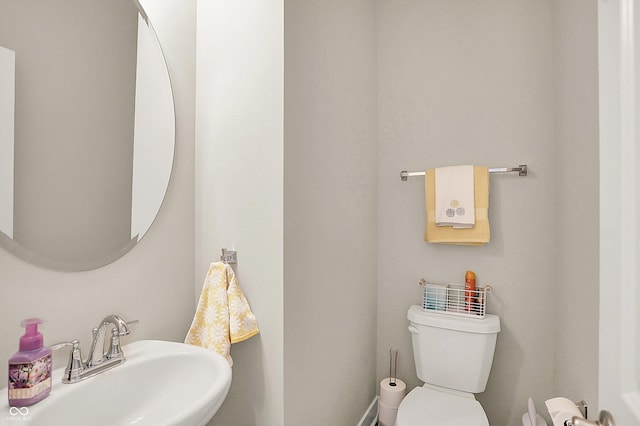 bathroom featuring toilet and a sink