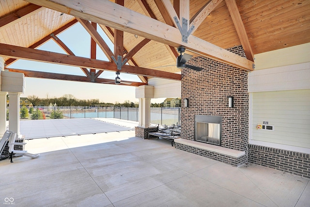 view of patio featuring a gazebo, ceiling fan, and fence