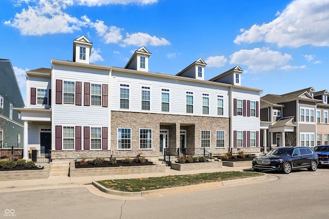 multi unit property featuring stone siding