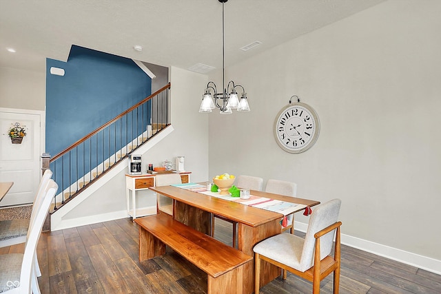 dining room featuring visible vents, baseboards, stairs, an inviting chandelier, and hardwood / wood-style flooring