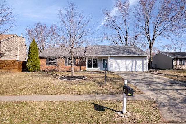 view of front of property with driveway, a front yard, a garage, and fence