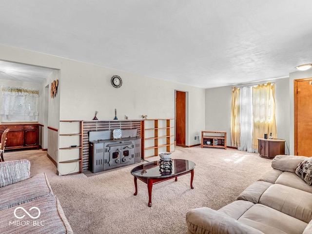 living area featuring baseboards and carpet