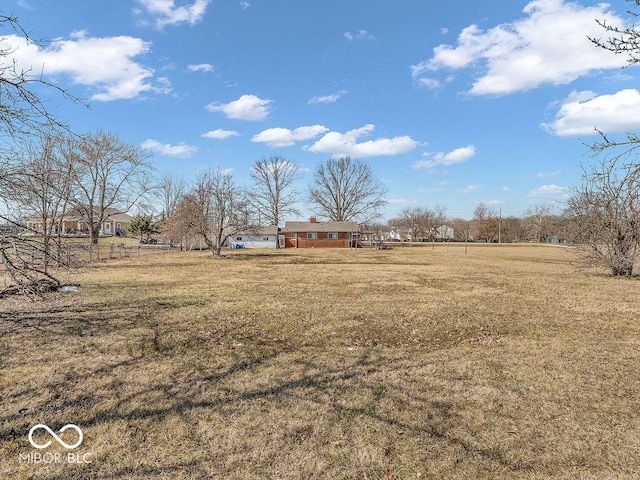 view of yard with a rural view