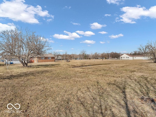 view of yard with a rural view