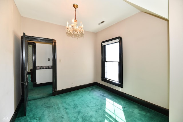 empty room featuring an inviting chandelier, visible vents, baseboards, and dark colored carpet