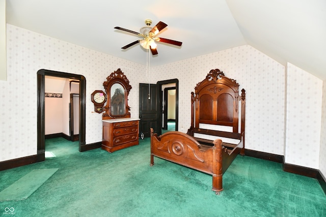 carpeted bedroom with baseboards, wallpapered walls, and lofted ceiling