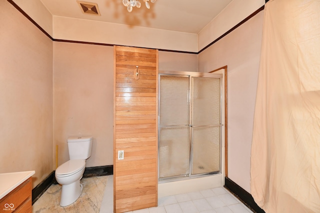 bathroom featuring visible vents, toilet, a stall shower, and vanity