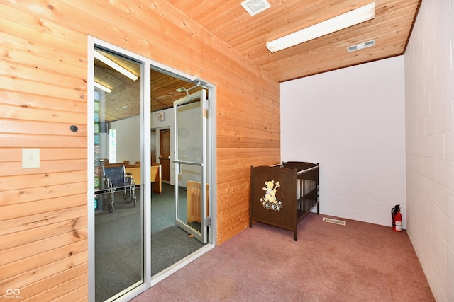 interior space featuring visible vents and wood ceiling