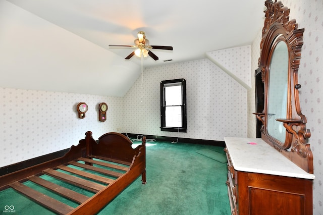 carpeted bedroom with visible vents, wallpapered walls, baseboards, vaulted ceiling, and a ceiling fan