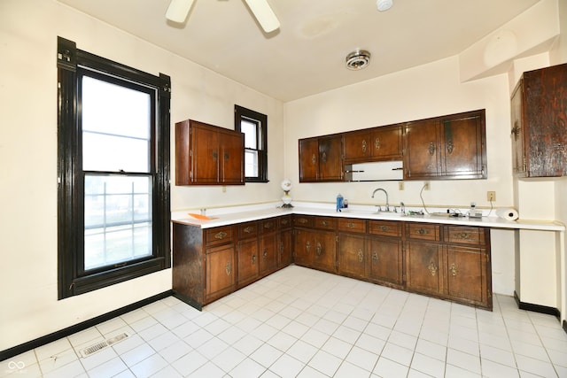 kitchen featuring light countertops, visible vents, a wealth of natural light, and a sink