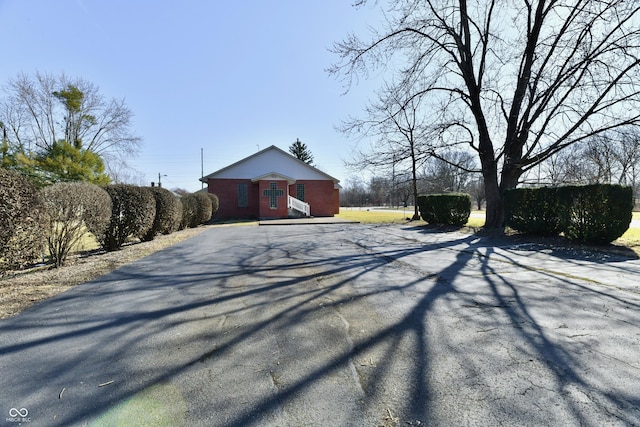 view of street with aphalt driveway