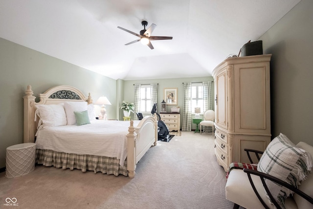 bedroom with light carpet, a ceiling fan, and vaulted ceiling