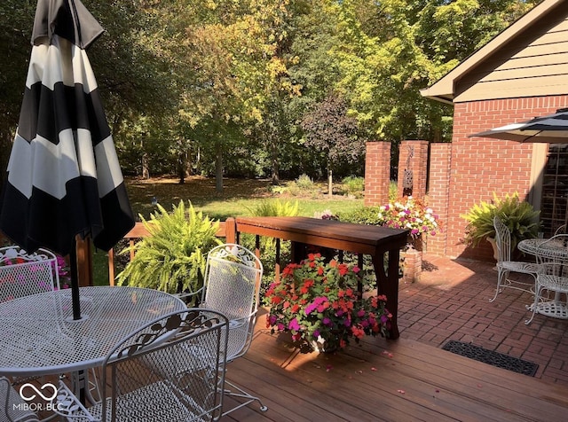 deck with outdoor dining area