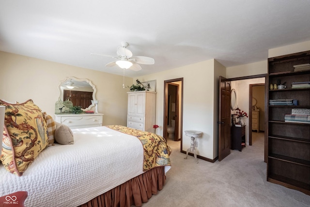 bedroom featuring baseboards, light colored carpet, and ceiling fan